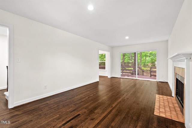 120 Kingston Dr, Chapel Hill, NC 27514 - unfurnished living room featuring a fireplace with flush hearth, wood finished floors, baseboards, and recessed lighting