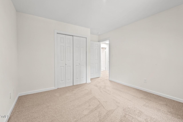 120 Kingston Dr, Chapel Hill, NC 27514 - unfurnished bedroom featuring carpet, a closet, and baseboards