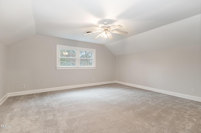 bonus room featuring lofted ceiling, carpet floors, and ceiling fan