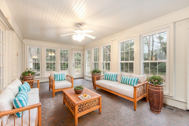 sunroom / solarium with wood ceiling and ceiling fan