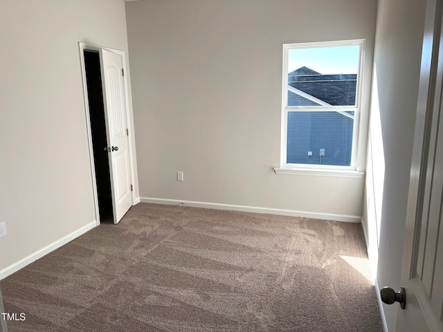 empty room featuring carpet floors