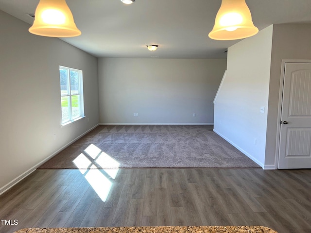 empty room featuring dark wood-type flooring