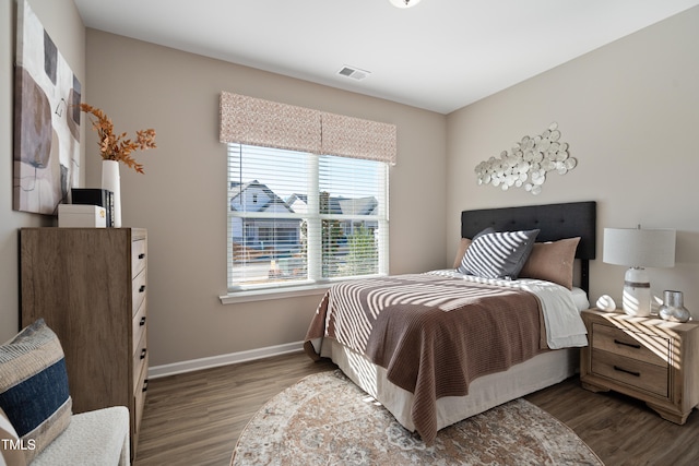 bedroom with wood-type flooring