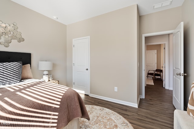 bedroom featuring dark hardwood / wood-style floors