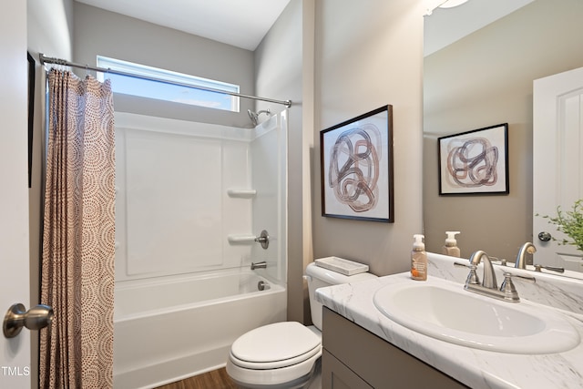 full bathroom with vanity, toilet, and shower / tub combo