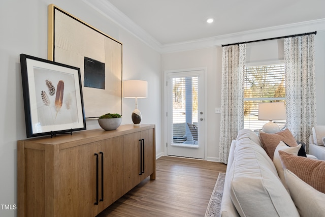 bedroom with crown molding, access to exterior, and light hardwood / wood-style flooring