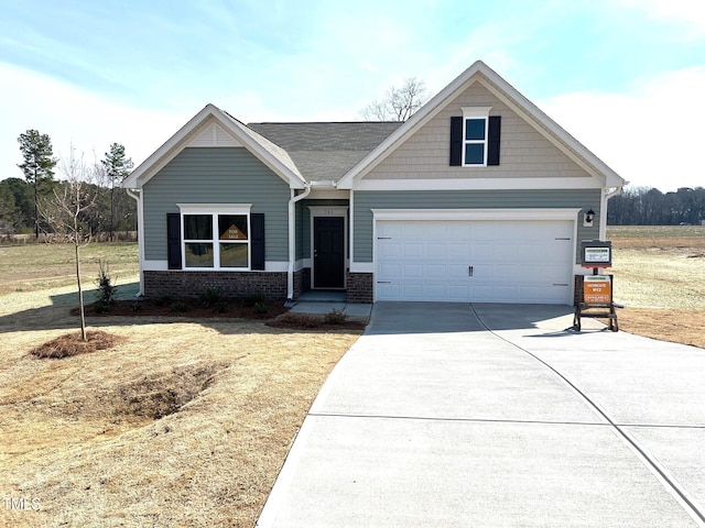 craftsman house with brick siding and driveway