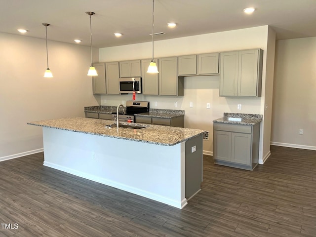 kitchen with a sink, appliances with stainless steel finishes, and gray cabinets