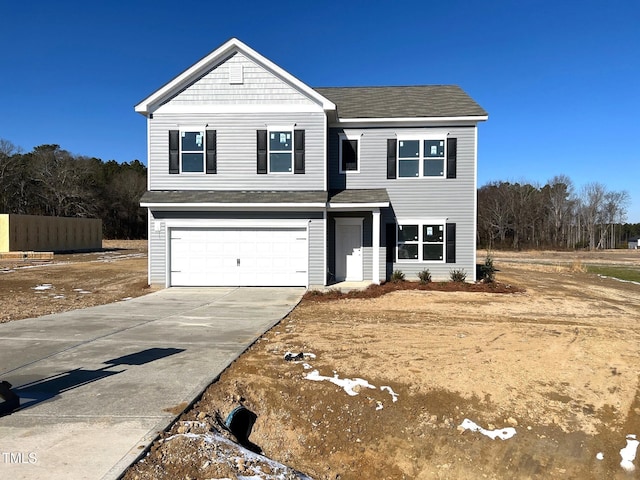 front of property with a garage