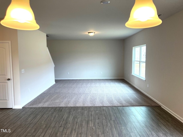 empty room featuring dark wood-type flooring