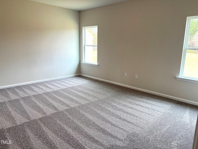 empty room featuring carpet flooring