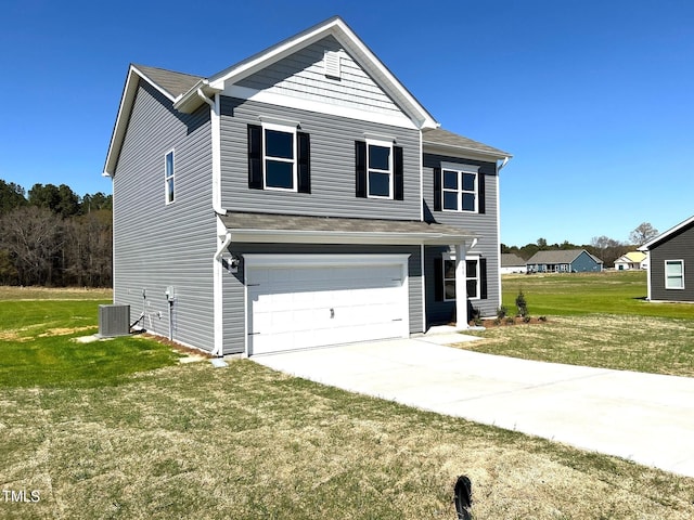 traditional-style house featuring central air condition unit, a front yard, an attached garage, and concrete driveway