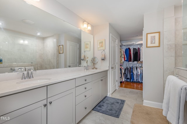 bathroom with vanity and hardwood / wood-style flooring