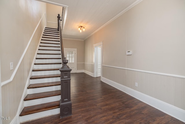 stairs with crown molding and hardwood / wood-style floors