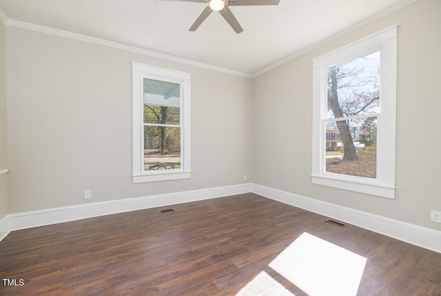 unfurnished room featuring crown molding, dark hardwood / wood-style flooring, and plenty of natural light