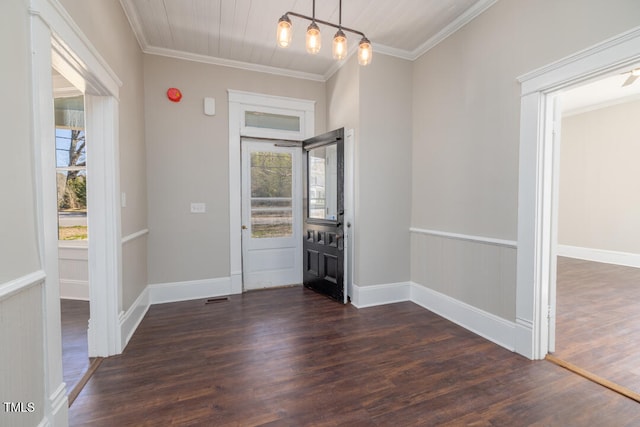 foyer entrance featuring crown molding and dark hardwood / wood-style flooring