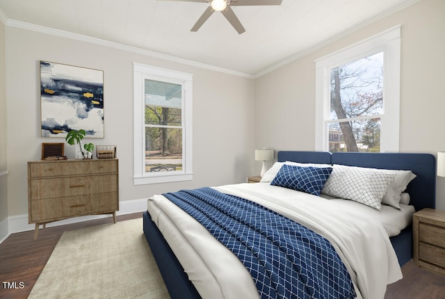 bedroom featuring ornamental molding, ceiling fan, and dark hardwood / wood-style flooring