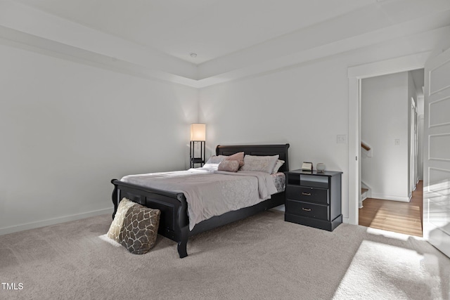 bedroom with light colored carpet