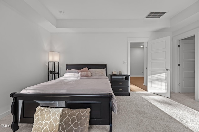 bedroom featuring light colored carpet