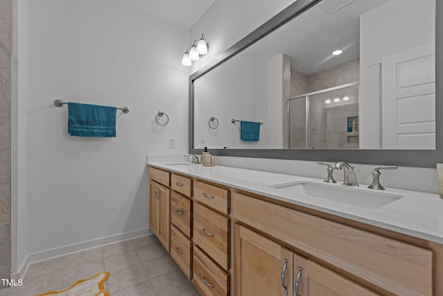 bathroom featuring tile patterned flooring, vanity, and an enclosed shower