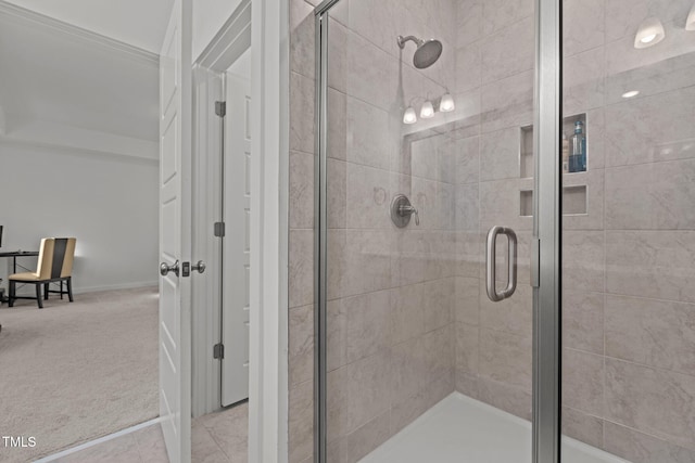 bathroom featuring tile patterned floors and a shower with shower door