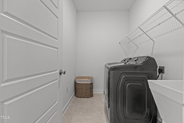 laundry room featuring sink and independent washer and dryer