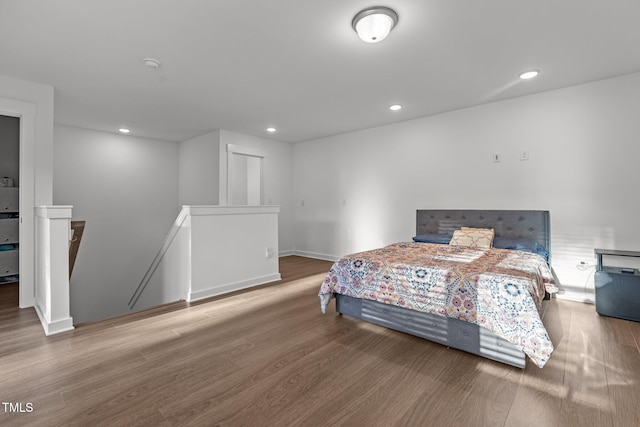 bedroom with hardwood / wood-style floors