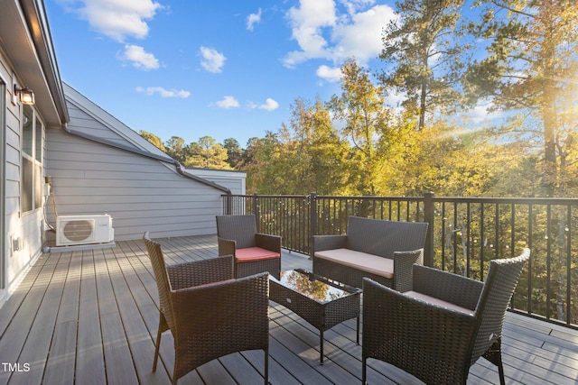 wooden deck with ac unit and an outdoor living space