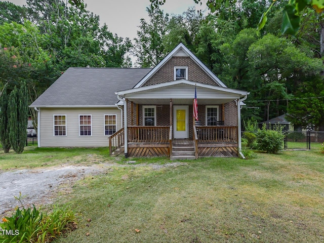 178 Paceville Rd, Selma, NC 27576 - bungalow-style house with a porch and brick siding