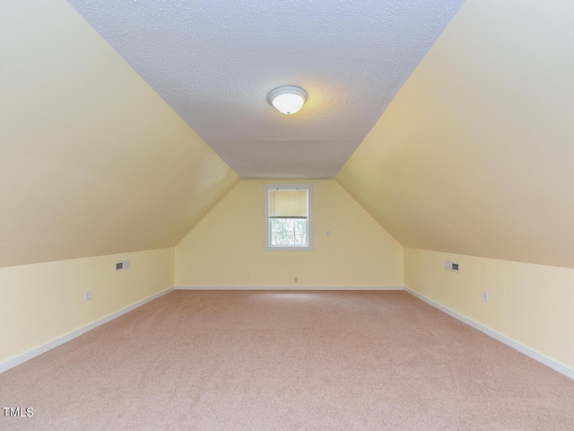178 Paceville Rd, Selma, NC 27576 - additional living space featuring light colored carpet, vaulted ceiling, and baseboards