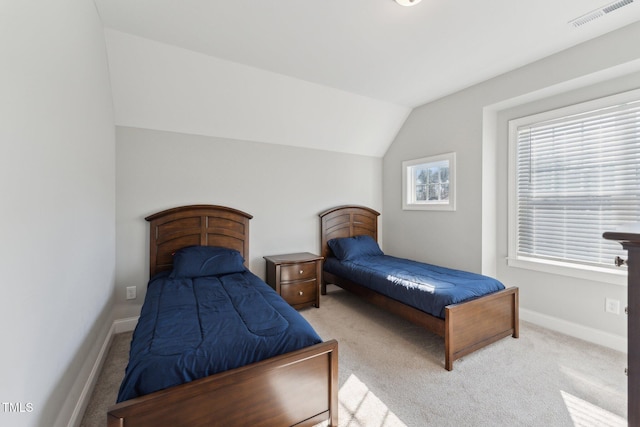 carpeted bedroom featuring vaulted ceiling