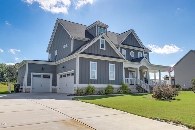 craftsman inspired home featuring a garage, a porch, and a front yard