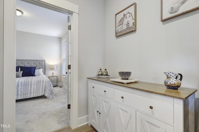 bedroom with light colored carpet