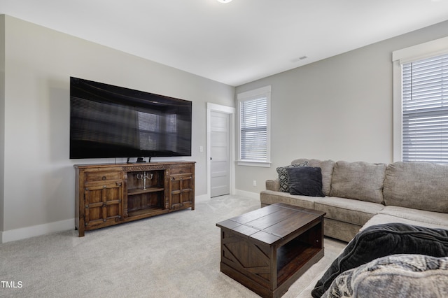 living room featuring light carpet