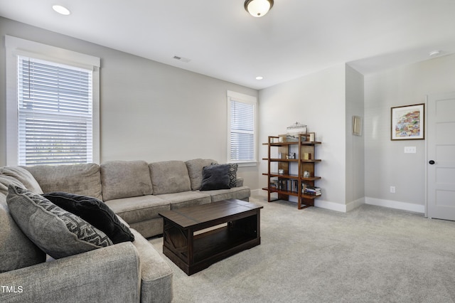 living room featuring light colored carpet