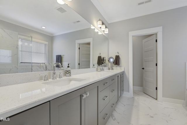 bathroom with crown molding and vanity