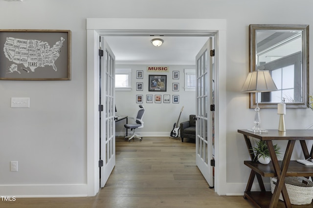 corridor featuring french doors and hardwood / wood-style floors