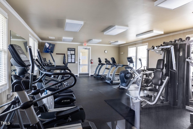 exercise room featuring crown molding