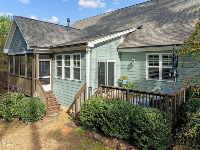 181 Colonial Ridge Dr, Pittsboro, NC 27312 - rear view of house with a sunroom, a wooden deck, and roof with shingles