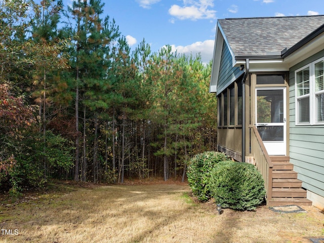 view of yard with a sunroom