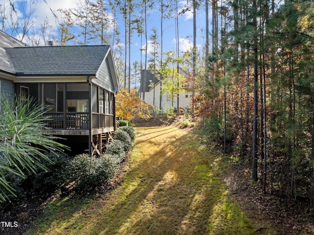 view of yard featuring a sunroom