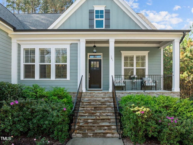 181 Colonial Ridge Dr, Pittsboro, NC 27312 - view of front of property featuring board and batten siding, a shingled roof, and a porch