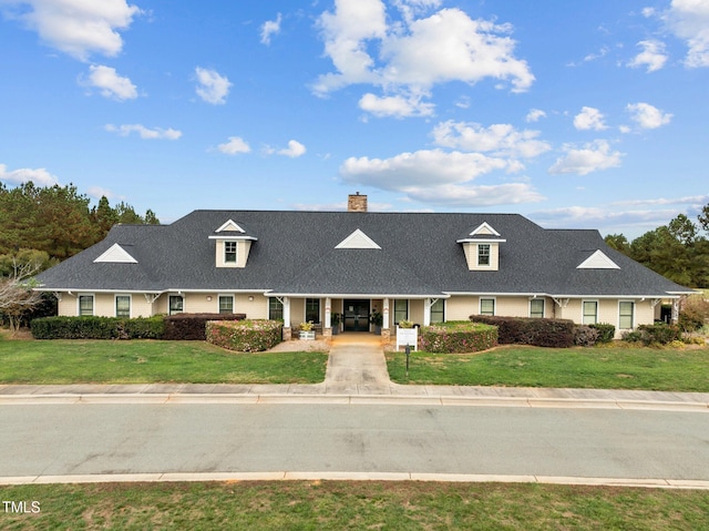 181 Colonial Ridge Dr, Pittsboro, NC 27312 - view of front of home featuring a chimney, a front lawn, a porch, and a shingled roof