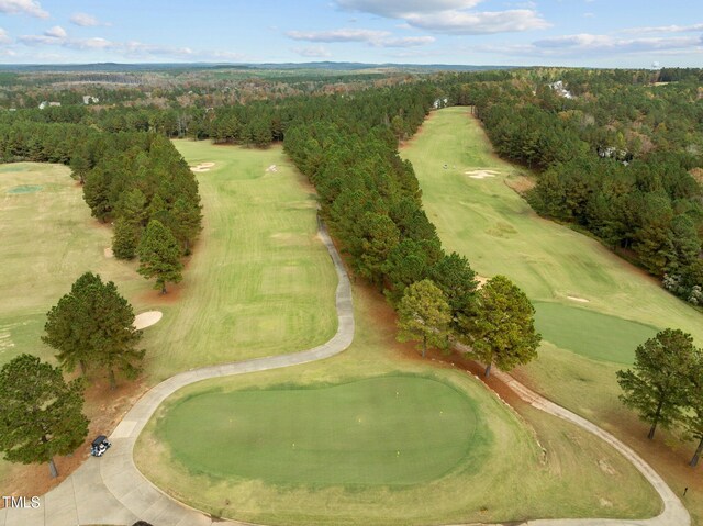 181 Colonial Ridge Dr, Pittsboro, NC 27312 - aerial view of property and surrounding area featuring a golf club and a heavily wooded area