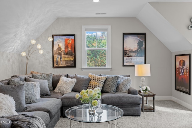 carpeted living room with lofted ceiling