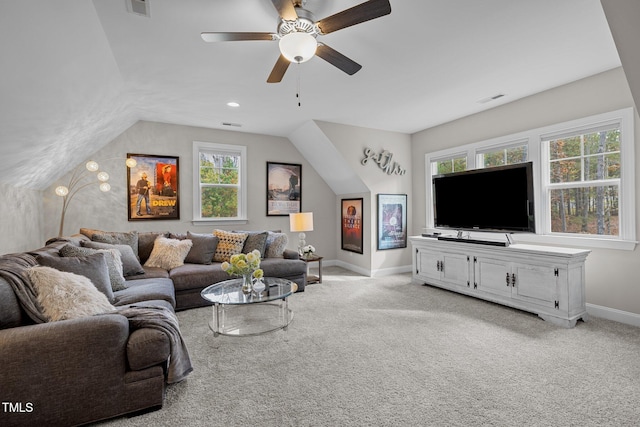 living room with ceiling fan, light colored carpet, and vaulted ceiling