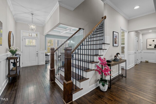 181 Colonial Ridge Dr, Pittsboro, NC 27312 - entrance foyer with stairs, crown molding, dark wood-type flooring, a chandelier, and a decorative wall