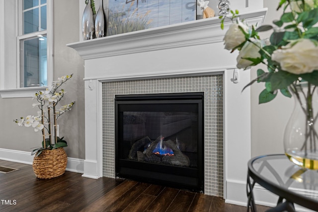 details featuring a fireplace and hardwood / wood-style flooring