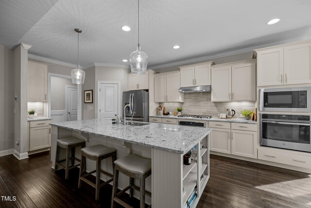 181 Colonial Ridge Dr, Pittsboro, NC 27312 - kitchen with stainless steel appliances, under cabinet range hood, recessed lighting, dark wood-type flooring, and a center island with sink