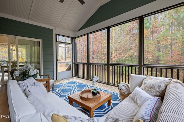 sunroom / solarium with ceiling fan and vaulted ceiling